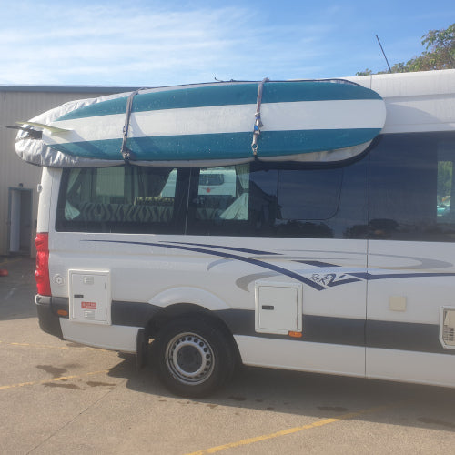 Transporting surf and paddle boards on the side of your camper van