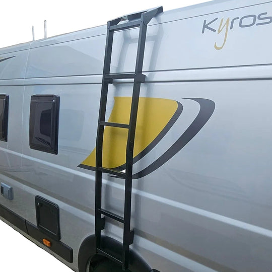 Black ladder attached to a Renault panel van.